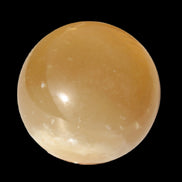 Honey Calcite sphere 47mm 162g in sunlight - Rocks and Things Store