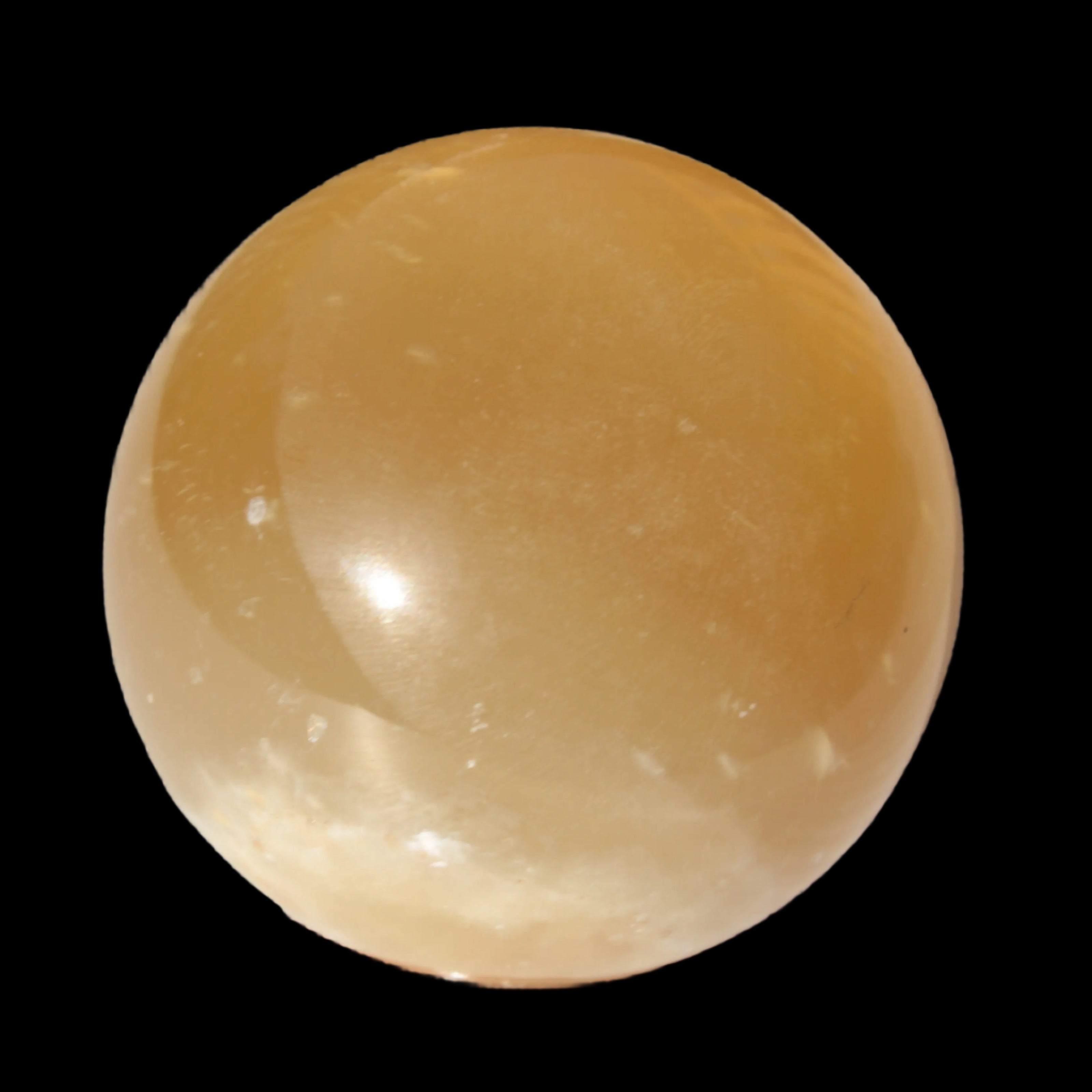 Honey Calcite sphere 47mm 162g in sunlight - Rocks and Things Store