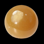 Honey Calcite sphere 47mm 162g in sunlight - Rocks and Things Store