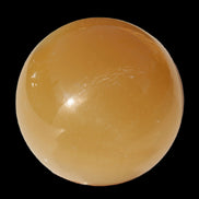 Honey Calcite sphere 47mm 162g in sunlight - Rocks and Things Store