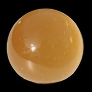 Honey Calcite sphere 47mm 162g in sunlight - Rocks and Things Store