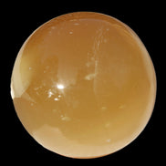 Honey Calcite sphere 47mm 162g in sunlight - Rocks and Things Store