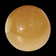 Honey Calcite sphere 47mm 162g in sunlight - Rocks and Things Store