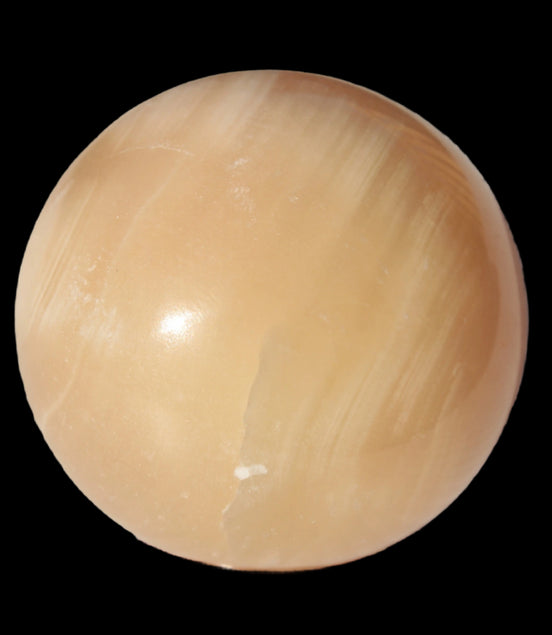 Honey Calcite sphere 49mm 167g in sunlight -  Rocks and Things Store