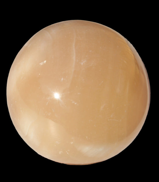 Honey Calcite sphere 49mm 167g in sunlight -  Rocks and Things Store