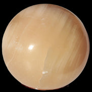 Honey Calcite sphere 49mm 167g in sunlight -  Rocks and Things Store