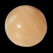 Honey Calcite sphere 49mm 167g in sunlight -  Rocks and Things Store