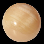 Honey Calcite sphere 49mm 167g in sunlight -  Rocks and Things Store