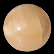 Honey Calcite sphere 49mm 167g in sunlight -  Rocks and Things Store