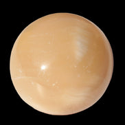 Honey Calcite sphere 49mm 167g in sunlight -  Rocks and Things Store