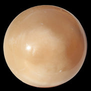 Honey Calcite sphere 49mm 167g in sunlight -  Rocks and Things Store
