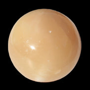 Honey Calcite sphere 49mm 167g in sunlight -  Rocks and Things Store