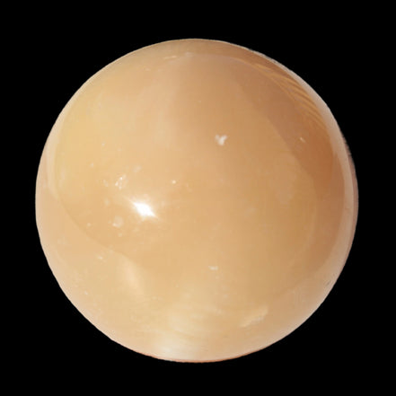 Honey Calcite sphere 49mm 167g in sunlight -  Rocks and Things Store