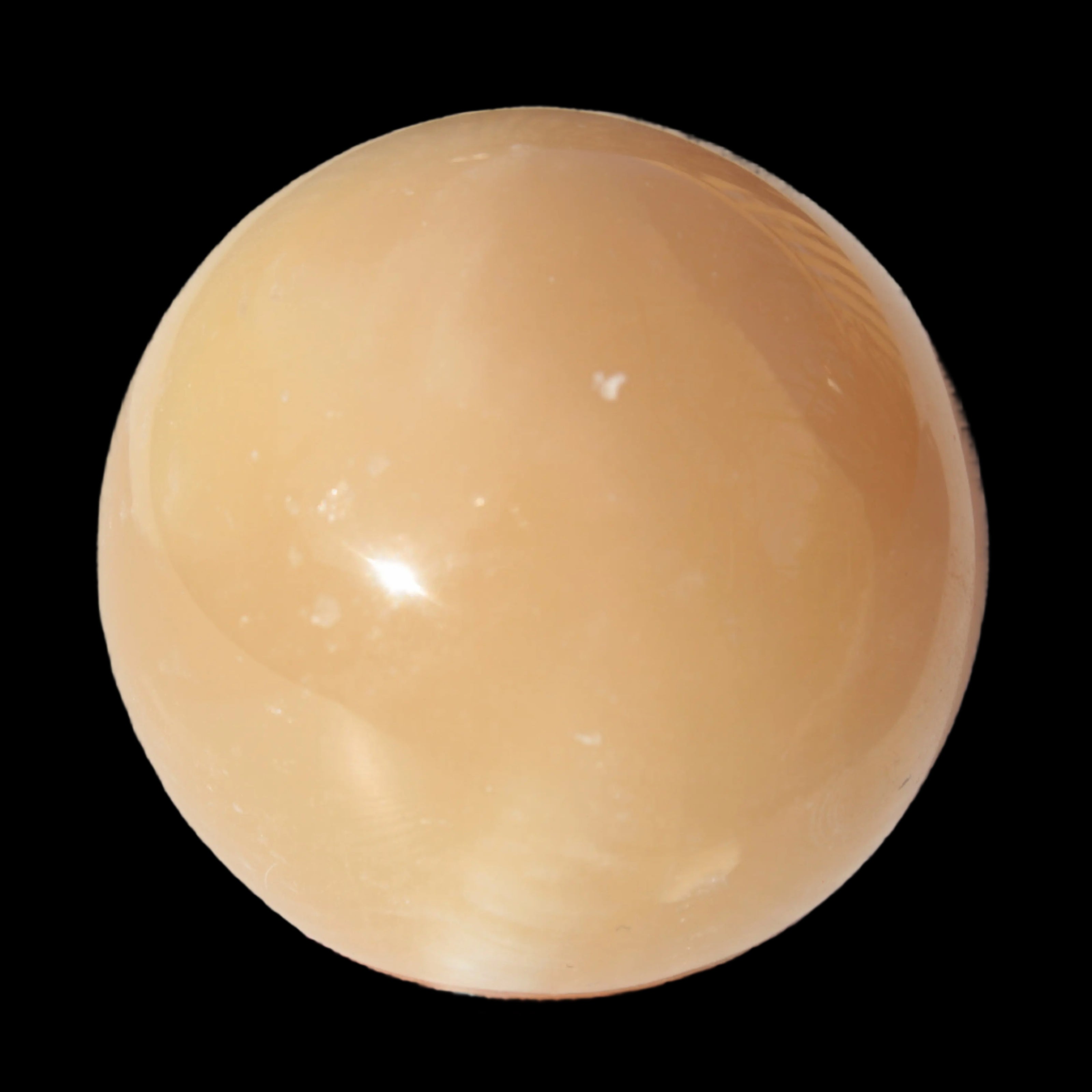 Honey Calcite sphere 49mm 167g in sunlight -  Rocks and Things Store