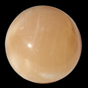 Honey Calcite sphere 49mm 167g in sunlight -  Rocks and Things Store