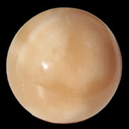Honey Calcite sphere 49mm 167g in sunlight -  Rocks and Things Store
