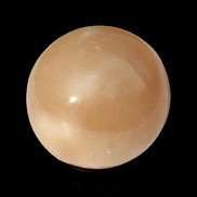 Honey Calcite sphere 49mm 167g in sunlight -  Rocks and Things Store