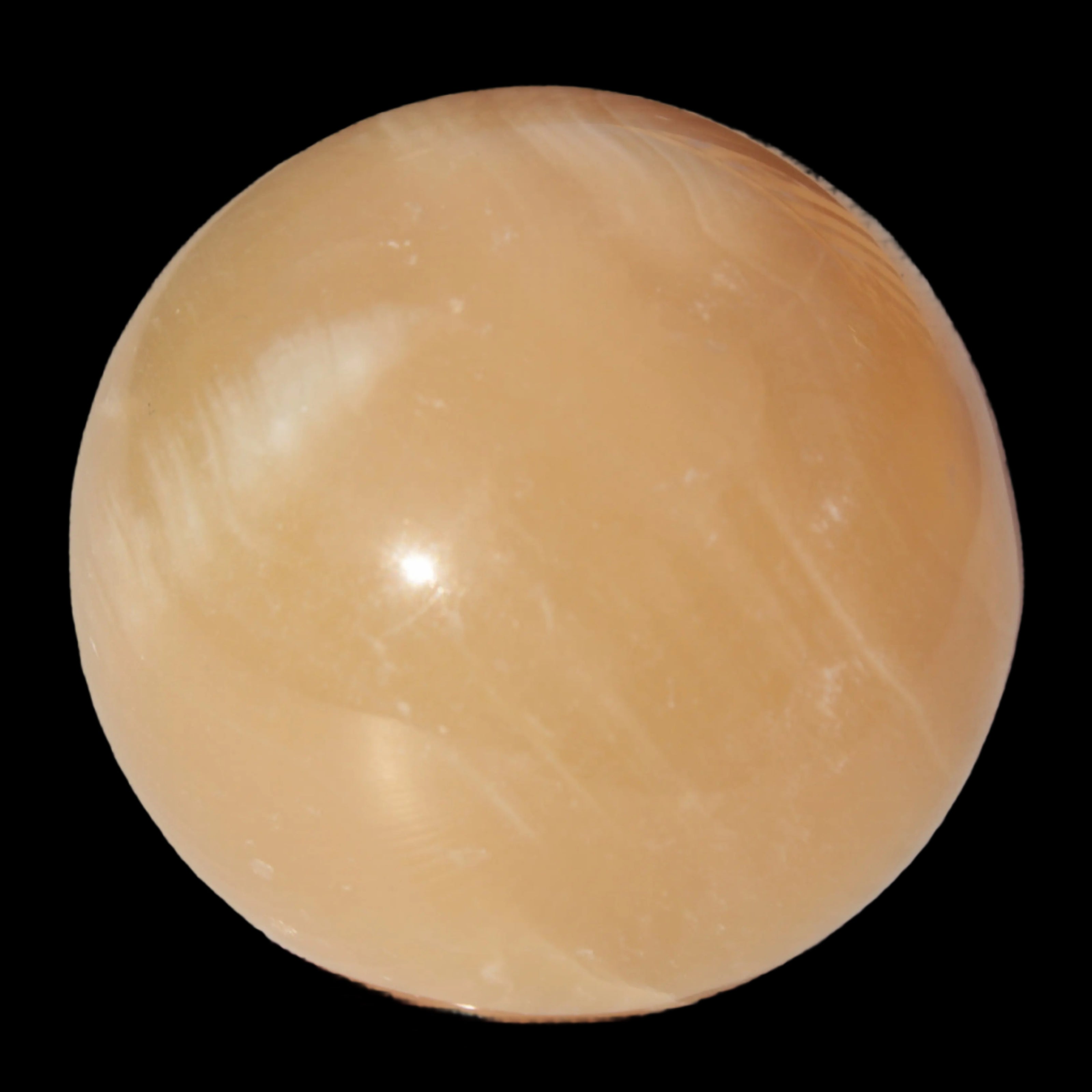 Honey Calcite sphere 49mm 167g in sunlight -  Rocks and Things Store