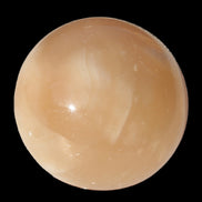 Honey Calcite sphere 49mm 167g in sunlight -  Rocks and Things Store