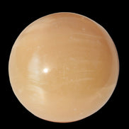 Honey Calcite sphere 49mm 167g in sunlight -  Rocks and Things Store