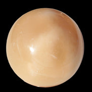 Honey Calcite sphere 49mm 167g in sunlight -  Rocks and Things Store