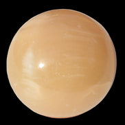 Honey Calcite sphere 49mm 167g in sunlight -  Rocks and Things Store