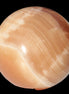 Honey Calcite sphere 53mm 175g in sunlight - Rocks and Things Store