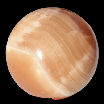 Honey Calcite sphere 53mm 175g in sunlight - Rocks and Things Store