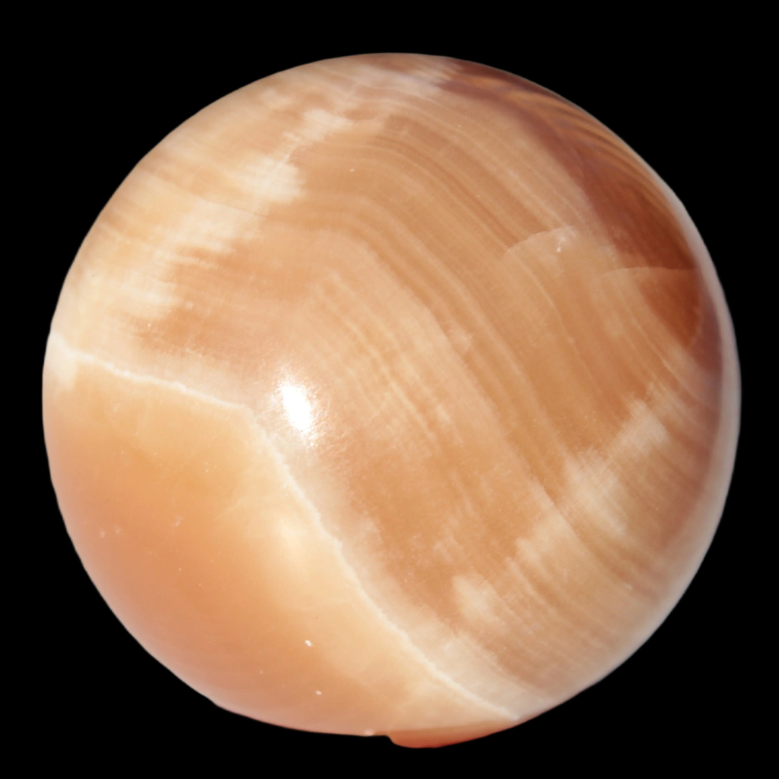 Honey Calcite sphere 53mm 175g in sunlight - Rocks and Things Store