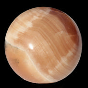 Honey Calcite sphere 53mm 175g in sunlight - Rocks and Things Store