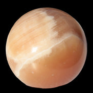Honey Calcite sphere 53mm 175g in sunlight - Rocks and Things Store