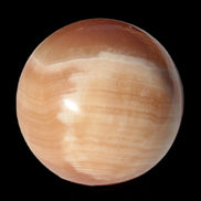 Honey Calcite sphere 53mm 175g in sunlight - Rocks and Things Store