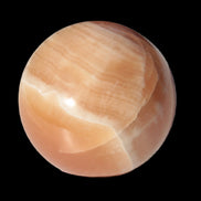 Honey Calcite sphere 53mm 175g in sunlight - Rocks and Things Store