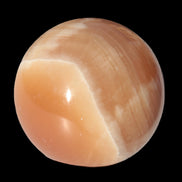 Honey Calcite sphere 53mm 175g in sunlight - Rocks and Things Store
