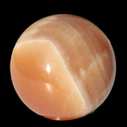 Honey Calcite sphere 53mm 175g in sunlight - Rocks and Things Store