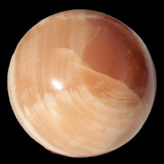 Honey Calcite sphere 53mm 175g in sunlight - Rocks and Things Store