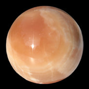 Honey Calcite sphere 53mm 175g in sunlight - Rocks and Things Store