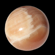 Honey Calcite sphere 53mm 175g in sunlight - Rocks and Things Store