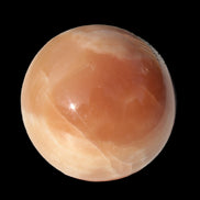 Honey Calcite sphere 53mm 175g in sunlight - Rocks and Things Store