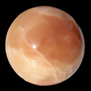 Honey Calcite sphere 53mm 175g in sunlight - Rocks and Things Store