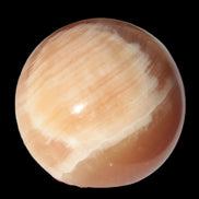 Honey Calcite sphere 53mm 175g in sunlight - Rocks and Things Store