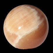 Honey Calcite sphere 53mm 175g in sunlight - Rocks and Things Store