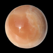 Honey Calcite sphere 53mm 175g in sunlight - Rocks and Things Store