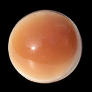 Honey Calcite sphere 53mm 175g in sunlight - Rocks and Things Store