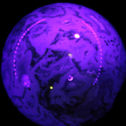 Moss Agate sphere 335g in UV light