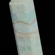 Pistachio Calcite obelisk 131*37*30mm 324g in sunlight - Rocks and Things Store