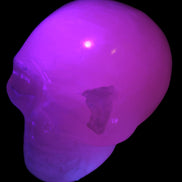 Mangano Calcite skull 40*55*45mm  160/161g in UV light - Rocks and Things Store