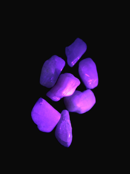 Small polished Kunzite crystals 6-8g in UV light