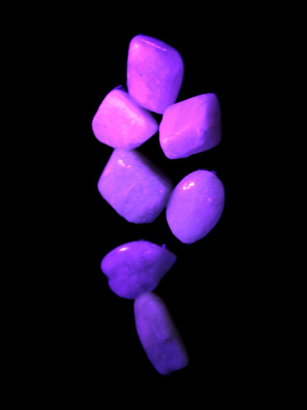 Small polished Kunzite crystals 6-8g in UV light