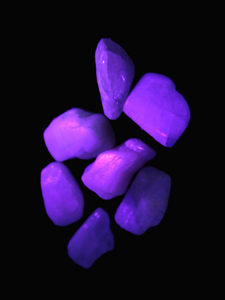 Small polished Kunzite crystals 6-8g in UV light